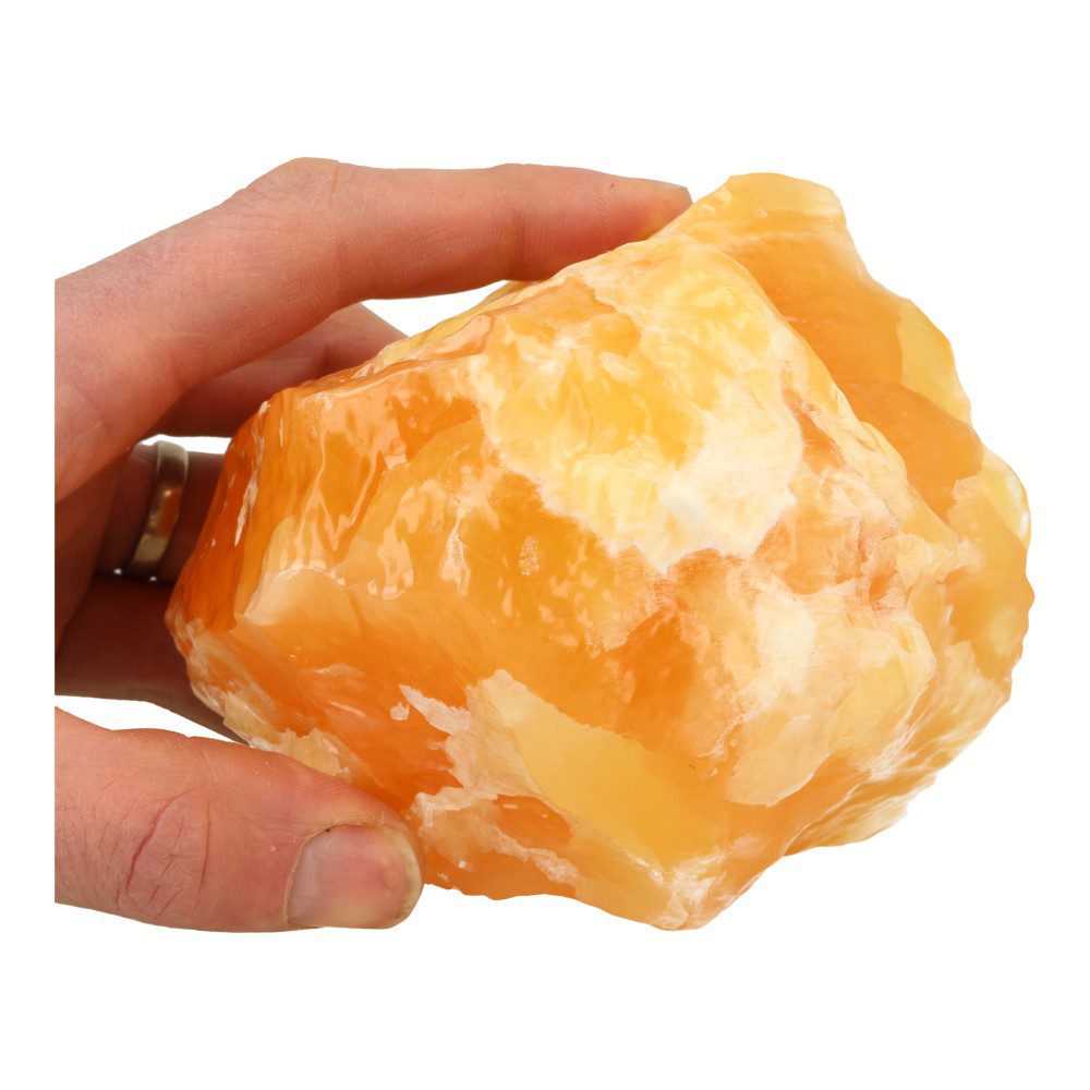 Flink stuk ruwe oranje calciet met heerlijk heldere kleur, in de hand om de grootte te zien